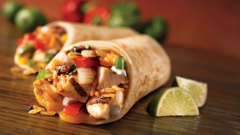 A wrap fajita with lime slices